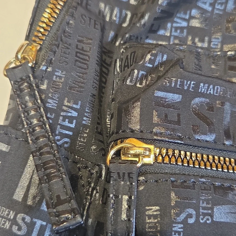 Steve Madden Black Logo Print Backpack Gold Tone Zippers Large Book Travel Bag